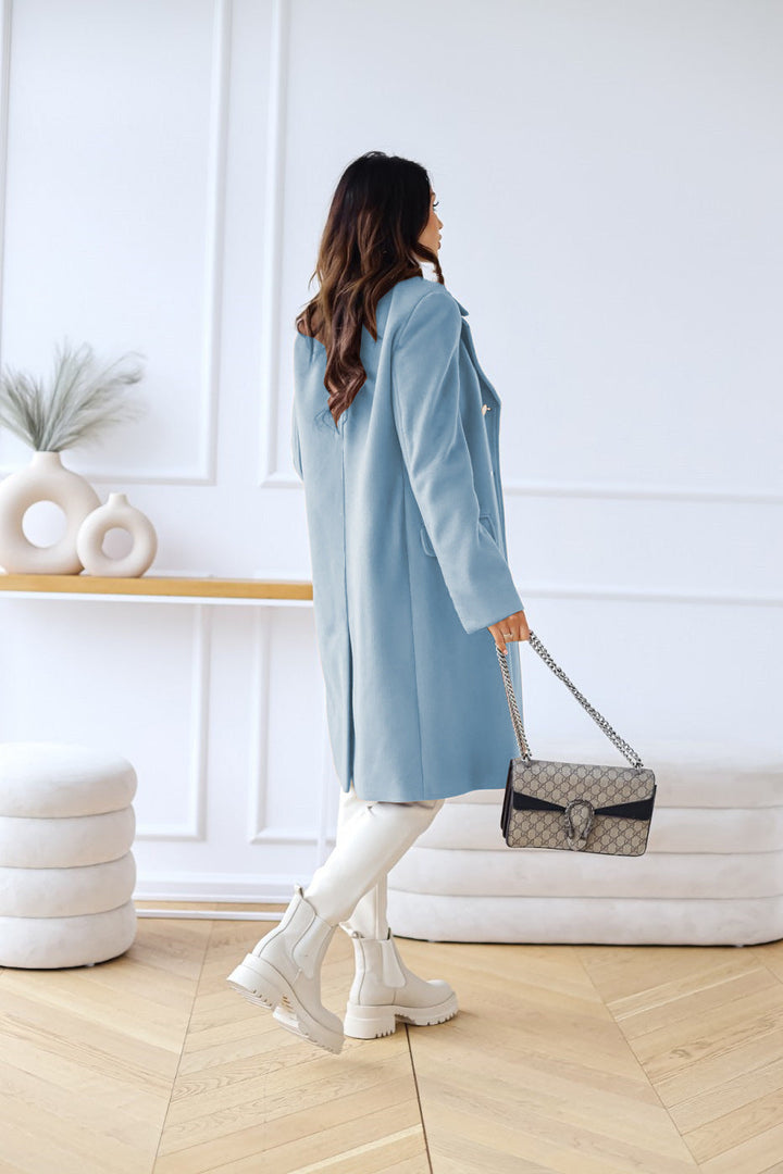 Women's elegant double-breasted long coat, combining classic style with winter warmth.