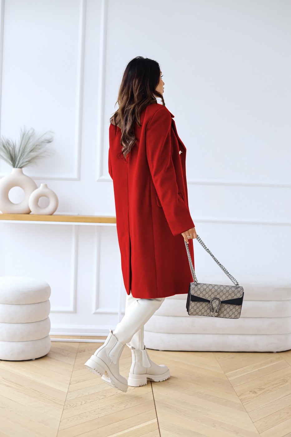 Classic double-breasted women's outerwear, a long coat for timeless fall and winter style.