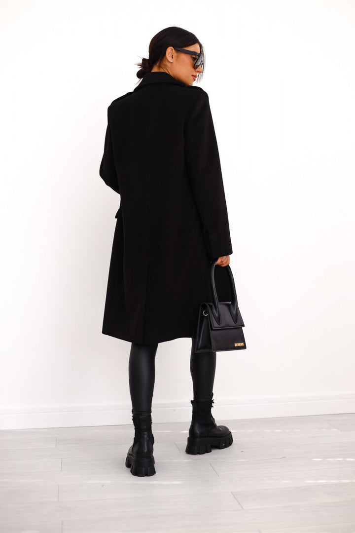 Stylish ladies' long trench coat, double-breasted design for sophisticated outerwear.