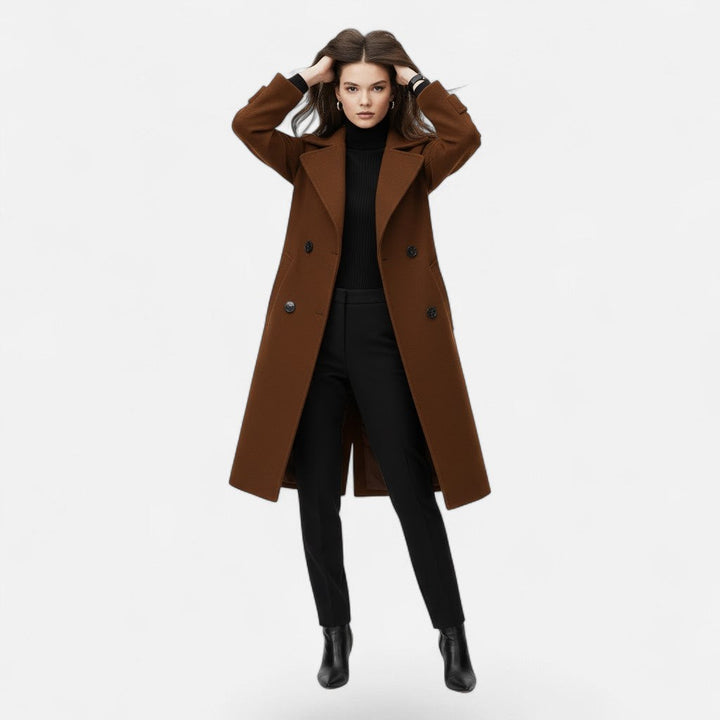 Slim fit women's double-breasted coat, elegant longline design. Stylish outerwear, perfect for fall and winter fashion.