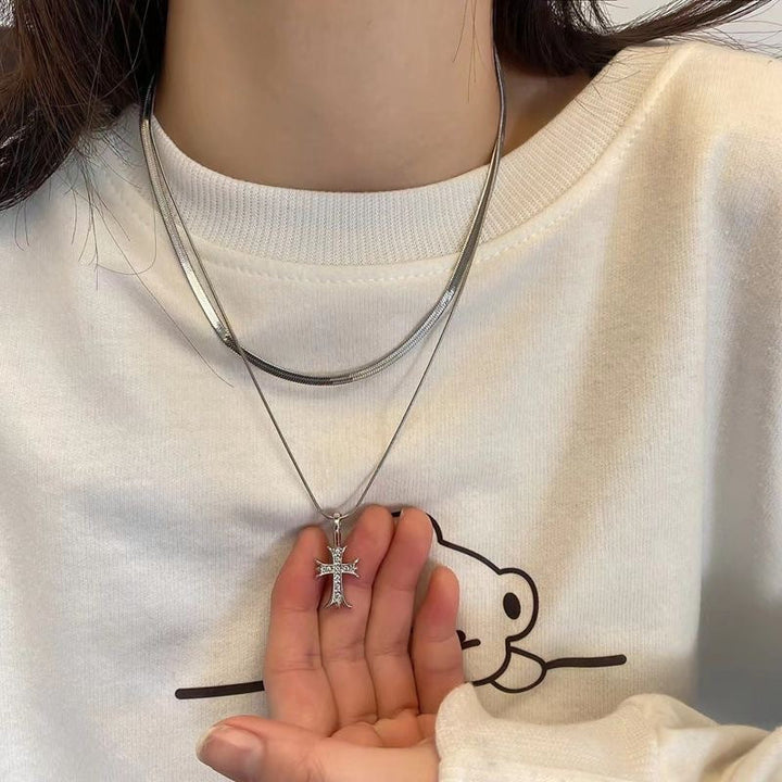 Elegant women's double layer cross pendant necklace. Silver tone religious jewelry, a perfect fashion accessory for her.