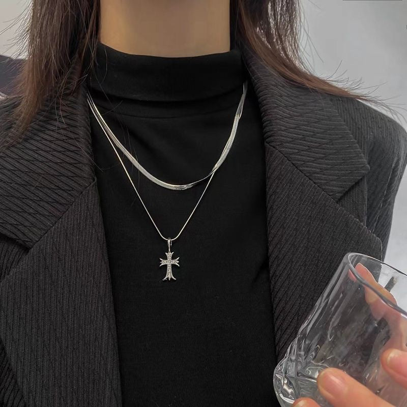 Chic double layer silver tone cross pendant necklace for women. Adjustable elegant religious jewelry & fashion accessory.