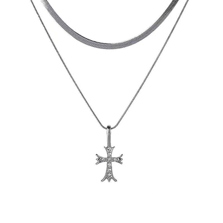 Stylish women's double layer cross pendant necklace. Silver tone religious jewelry, a versatile and elegant fashion accessory.