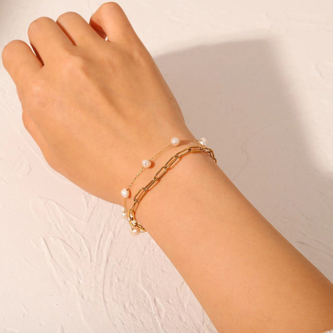 Elegant women's double layered pearl chain anklet, a stylish adjustable foot jewelry accessory.