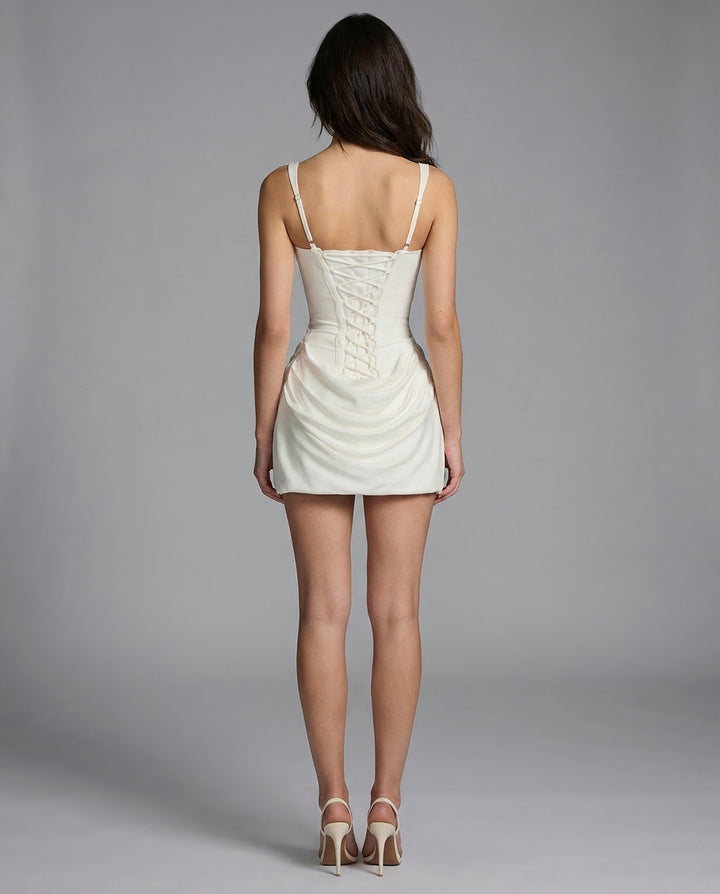 Sculpting women's bodycon mini dress with draped front and a defined corset waist. Very chic.