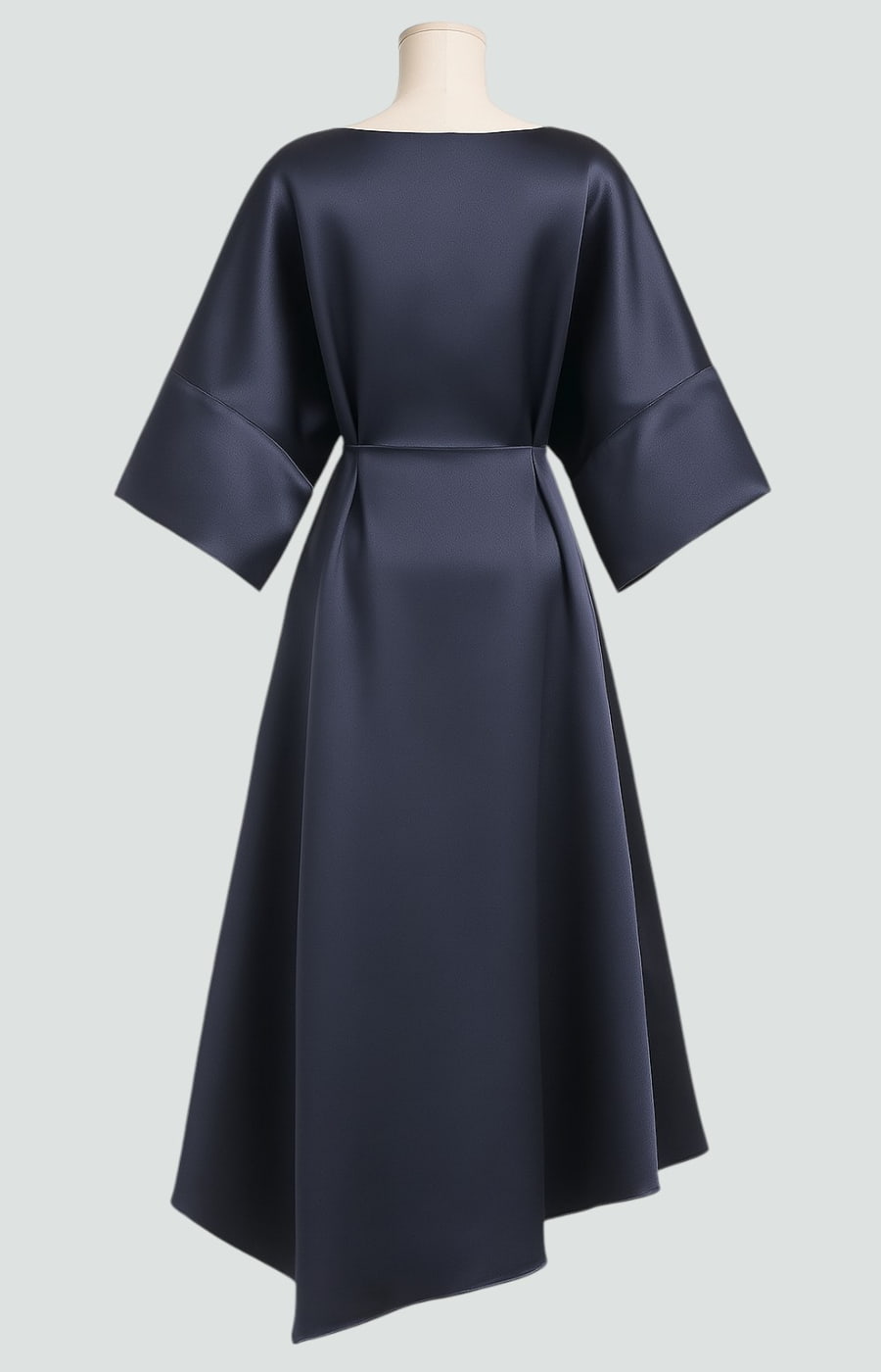 Sophisticated long women's dress, elegantly draped with a brooch, suitable for formal or evening events.