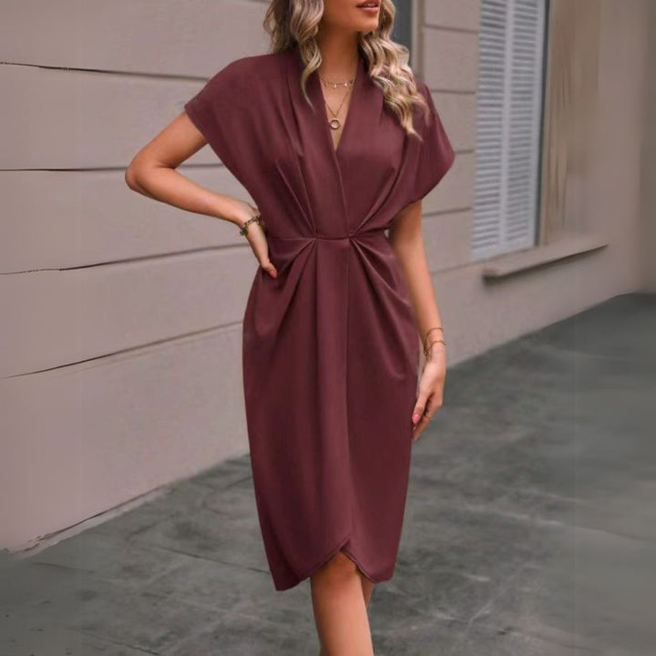 Elegant women's draped midi dress, flattering V-neck, cap sleeves & chic tulip hem, perfect for occasions.