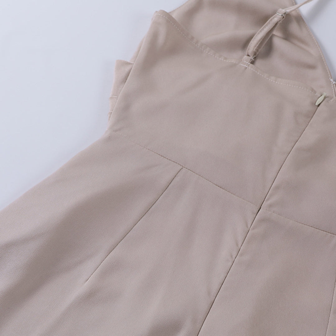 Stylish women's celebration outfit: draped midi dress with a split, backless for evening.