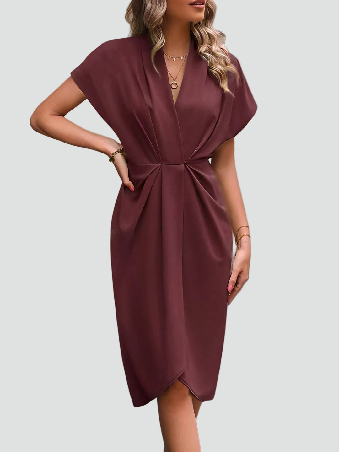 Side view: Elegant women's draped midi dress, featuring a flattering V-neck and a high leg split. Sophisticated fashion.