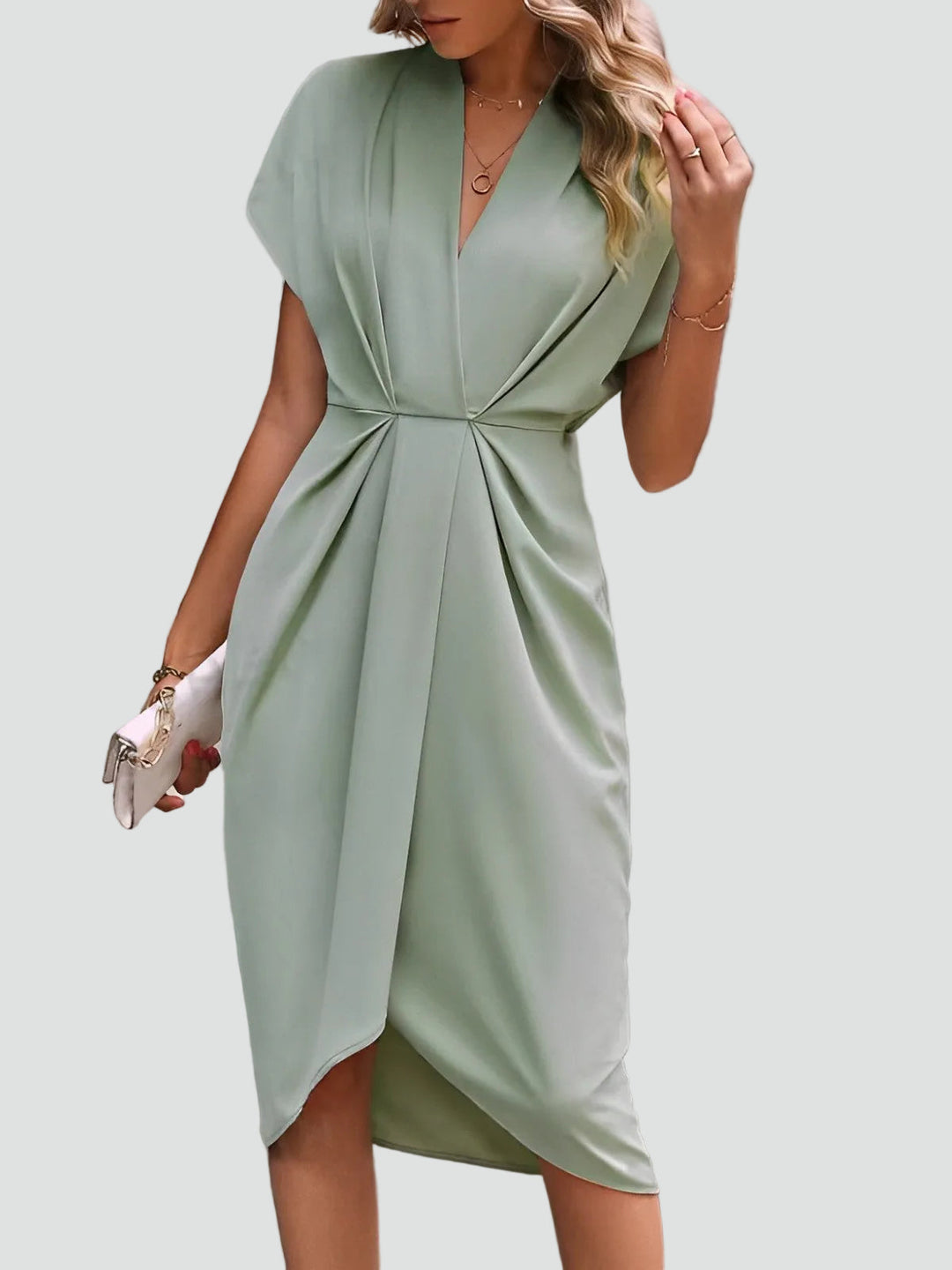 Luxurious women's midi dress with soft draped fabric, V-neck, and split. Stylish & sophisticated occasion wear.