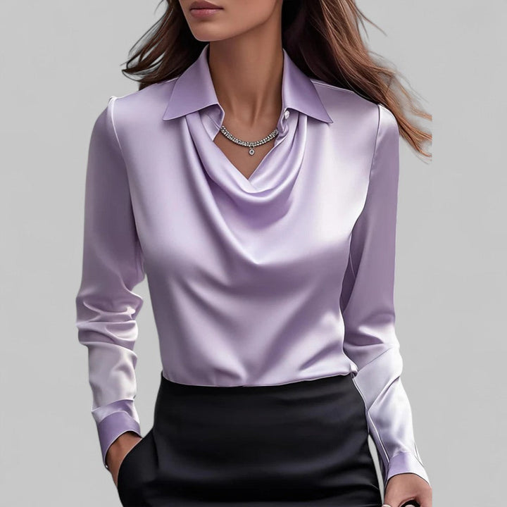 Women's fashion top: sophisticated long sleeve blouse with a flattering draped neck.