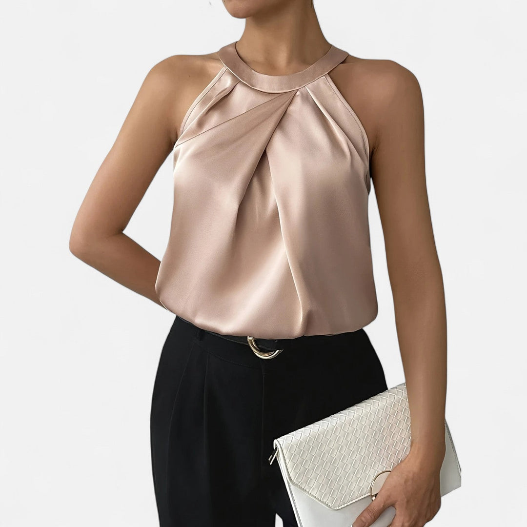 Modern women's elegant draped top, a stylish sleeveless apparel choice for a refined and sophisticated look.