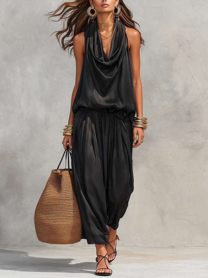 Elegant women's draped two-piece set with flowy top & wide-leg pants. Chic & comfortable for summer evenings.