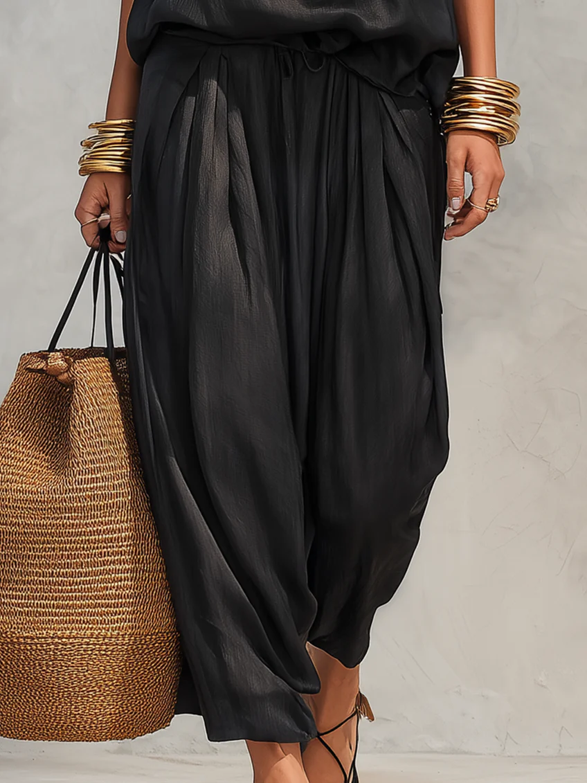 Versatile women's elegant draped two-piece set. Comfortable wide-leg design, ideal for summer evenings or casual chic.