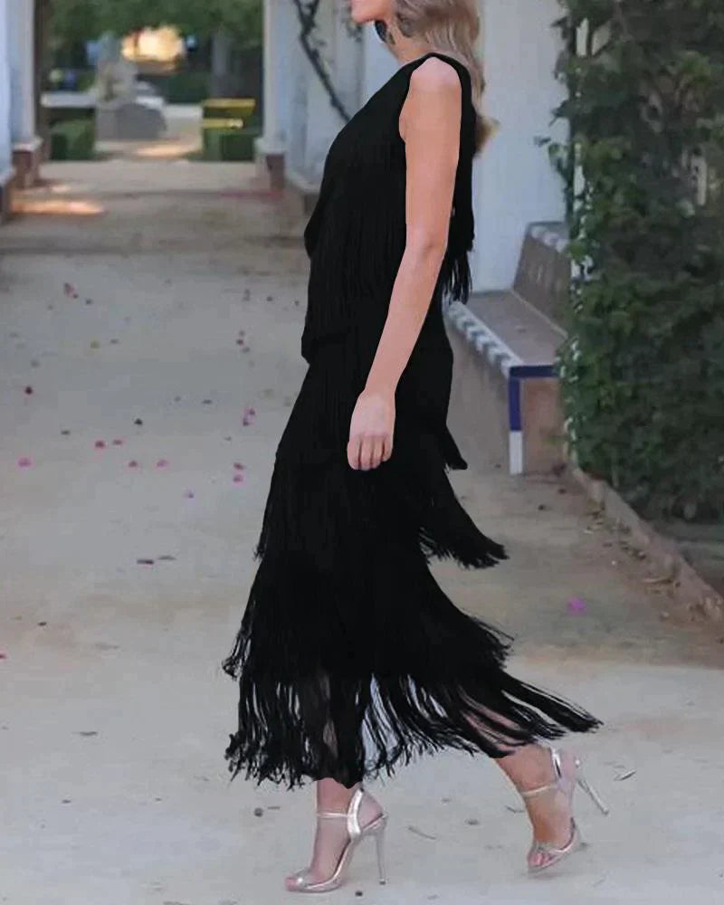 Modern women's maxi dress featuring stylish dropped shoulders, perfect for elegant formal wear.