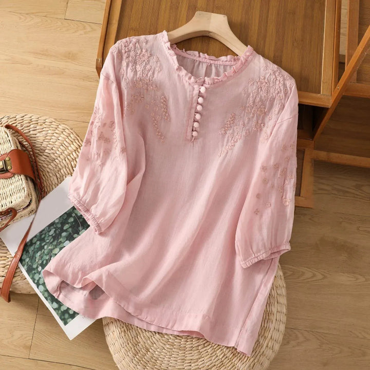 Comfortable women's embroidered top with 3/4 sleeves and button front, ideal for casual elegant daily wear.
