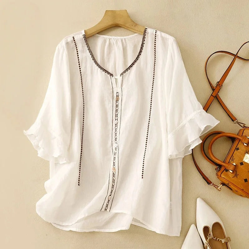 Elegant women's embroidered blouse with V-neck & ruffled 3/4 sleeves. Perfect casual top for summer fashion.