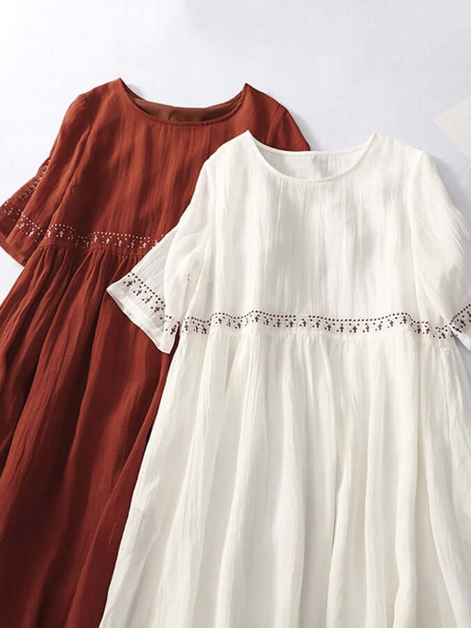 Elegant women's embroidered loose-fit dress, perfect for spring/summer comfort & style.