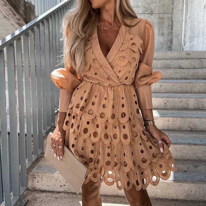 Fashionable women's embroidered mini dress with sheer sleeves, cutwork, ideal for summer parties.