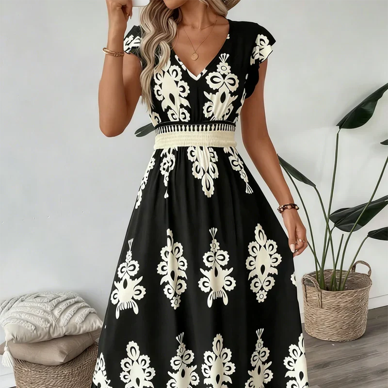 Women's elegant embroidered summer midi dress in an outdoor setting, perfect for casual elegant occasions.