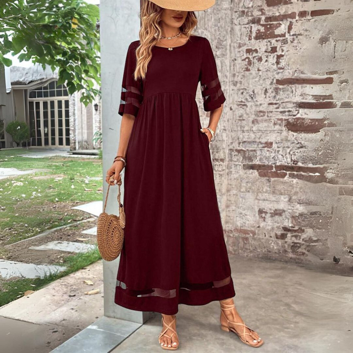 Sophisticated women's elegant empire waist maxi dress, perfect for formal or semi-formal events.