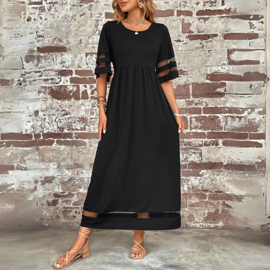 Woman in elegant blue empire waist maxi dress, showcasing flattering style and comfortable fit.