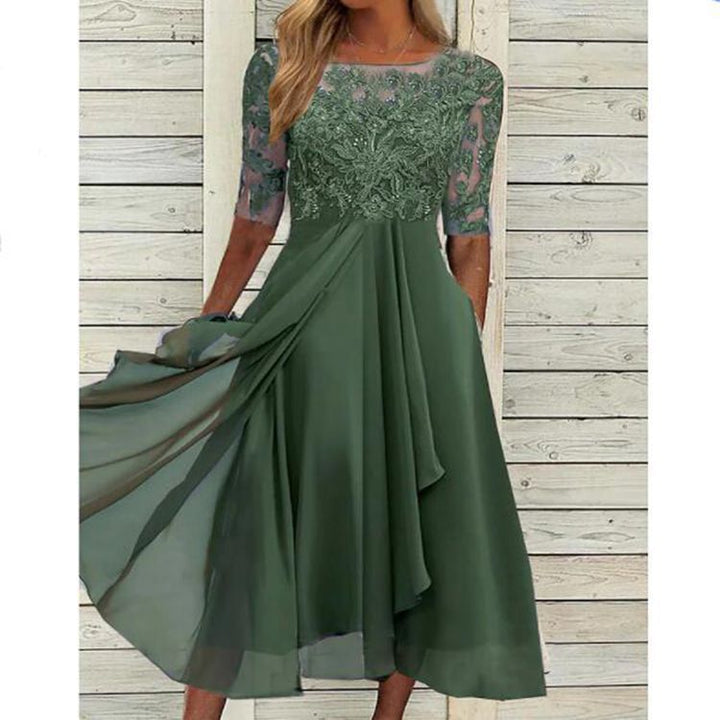 Elegant women's evening dress for special occasions. Long maxi dress with a round neck and half sleeves.