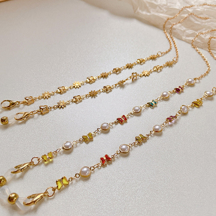 Stylish women's glasses chain featuring vibrant crystals & delicate pearls, perfect for securing your eyewear.