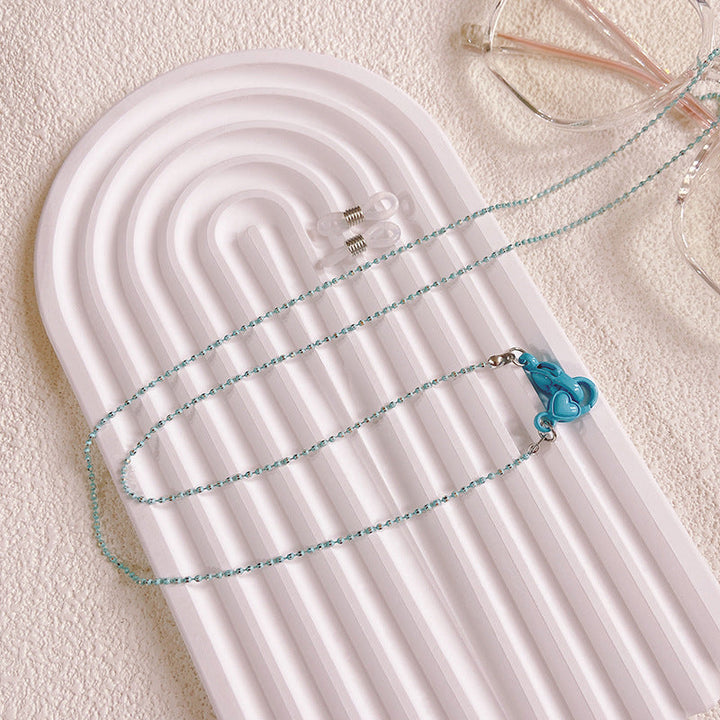 Tiffany blue & pink women's eyeglass holder chain with elegant heart pendant. A stylish and secure eyewear accessory.