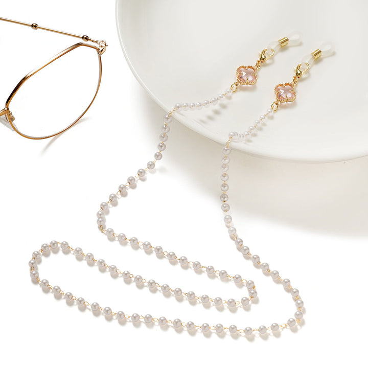 Stylish pearl eyeglass holder chain for women, keeping eyewear secure and fashionable.