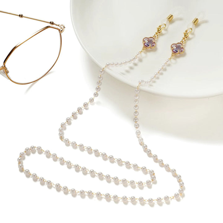 Women's elegant pearl eyeglass chain, a secure and stylish glasses holder accessory.