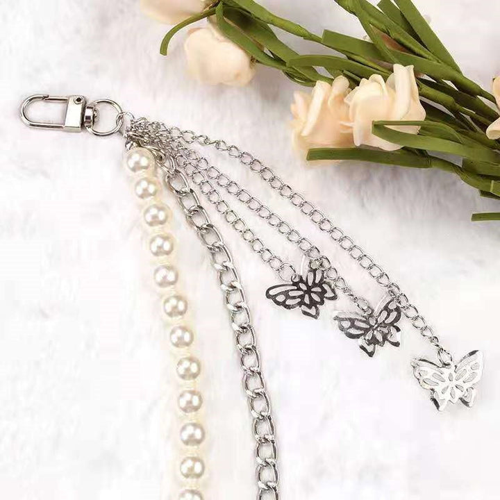 Women's clear design pearl and chain fashion belt, a trendy statement piece with an eye-catching butterfly.