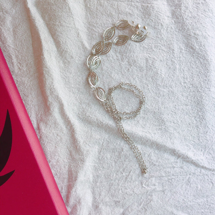 Beautiful women's elegant filigree necklace in silver & gold, detailed leaf motif, fashionable jewelry.