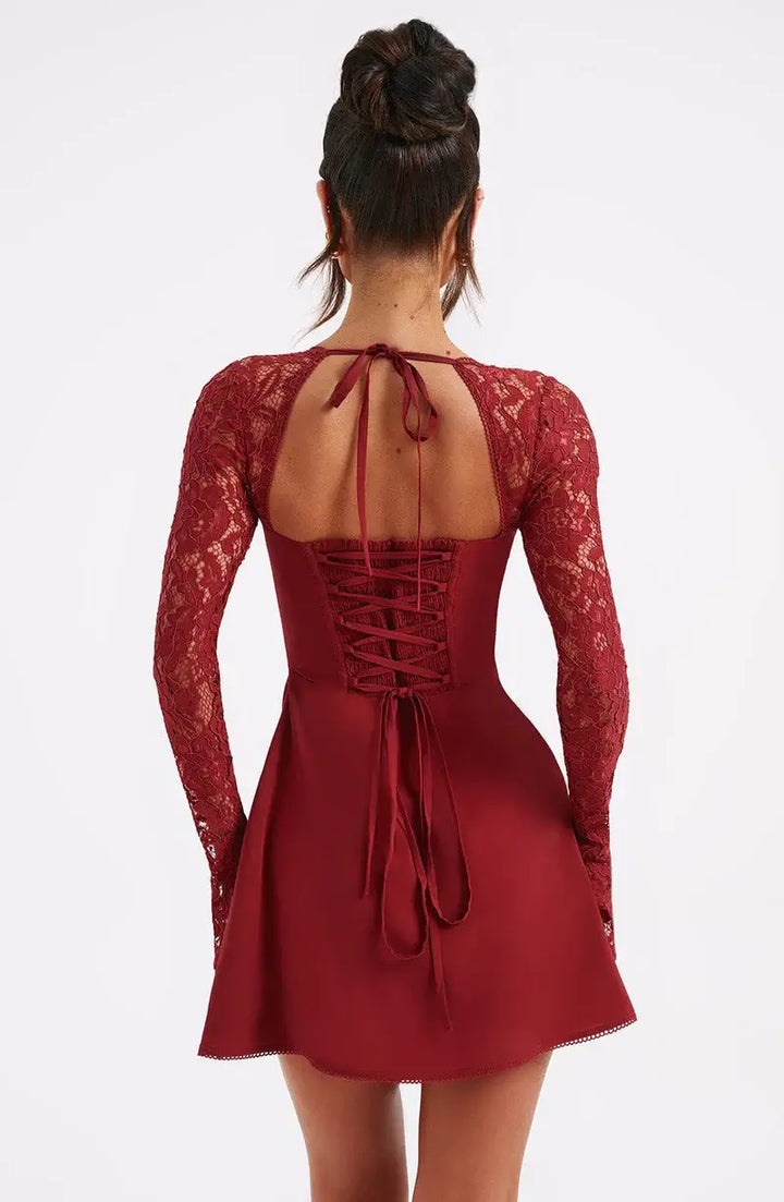 Close-up of elegant women's lace sleeve mini dress, showcasing the delicate lace and fit & flare design.