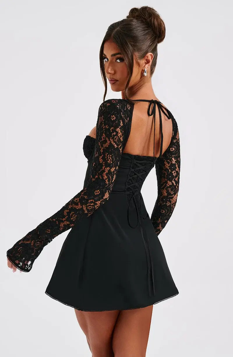 Chic women's lace sleeve mini dress in a flattering fit & flare cut, perfect for romantic evening wear.