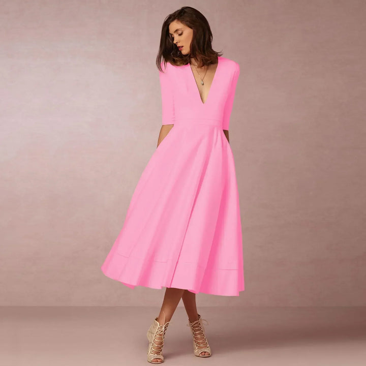 Beautiful green fitted midi dress for women, embodying elegant summer style for various events. Fashionable.