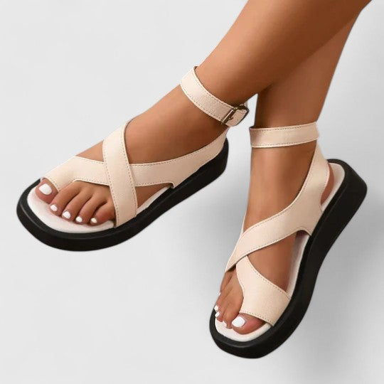Comfortable flat women's sandals with adjustable straps, offering a secure fit for everyday elegant summer style.