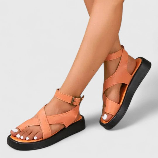Full view of elegant flat women's sandals, showcasing adjustable straps for comfort & chic summer style.