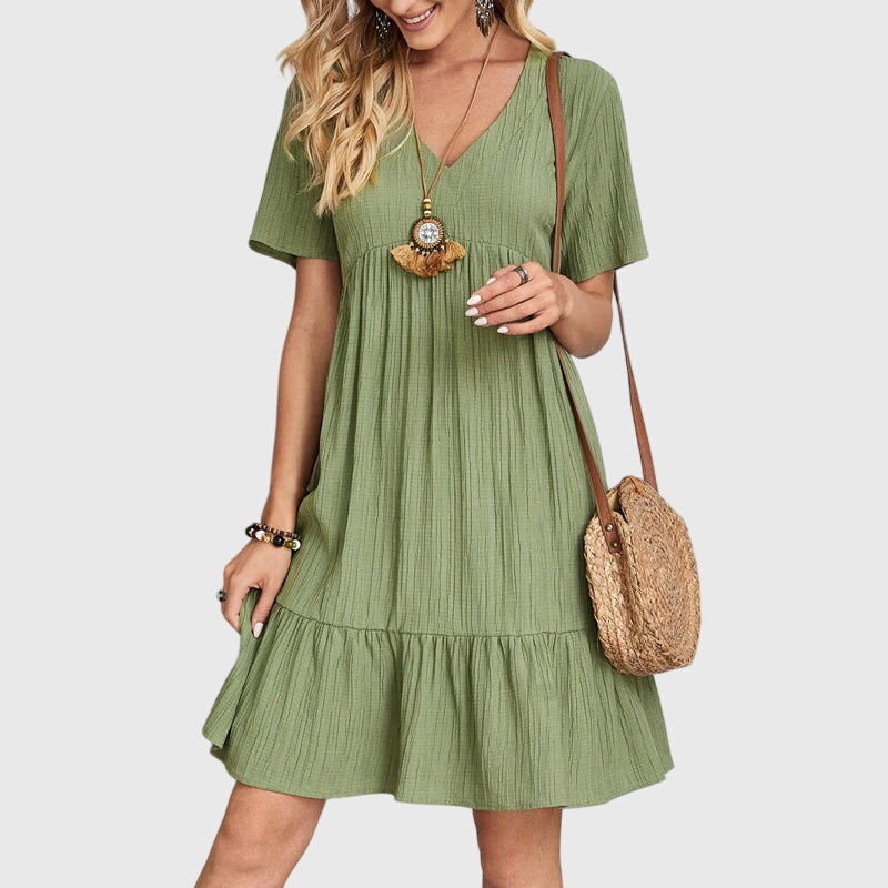 Flattering women's dress, elegant design enhances shape. Perfect for summer parties.