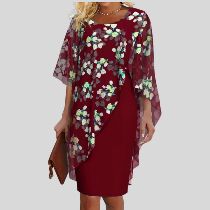 Chic sleeveless A-line midi dress for women, featuring a graceful floral print and feminine silhouette.