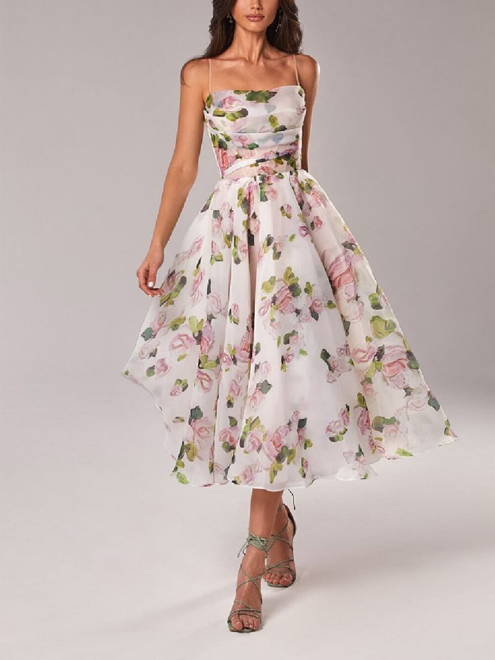 Elegant women's floral A-line midi dress with spaghetti straps, perfect for summer parties or wedding guests.