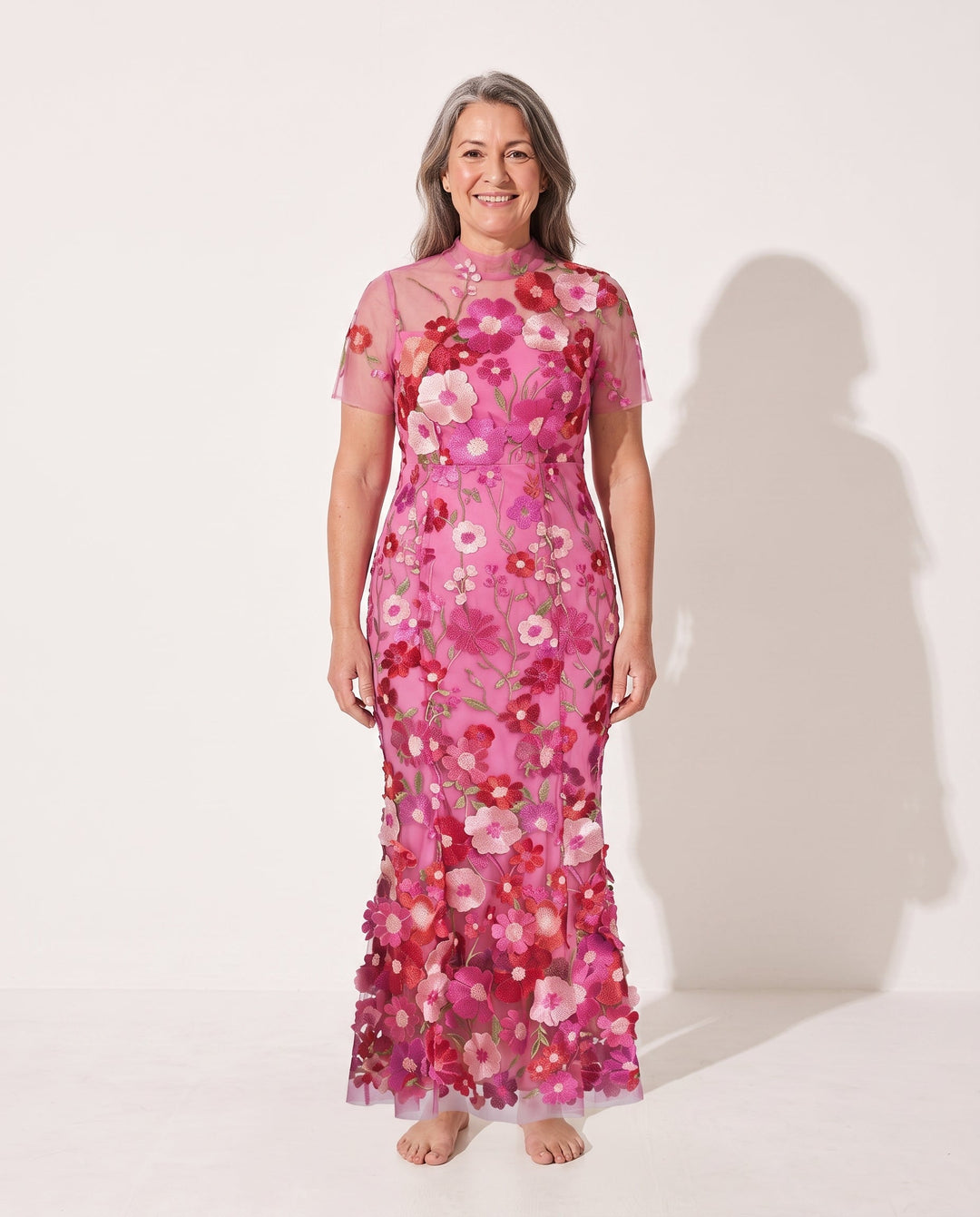 Elegant women's floral appliqué midi dress with sheer sleeves, perfect for a wedding guest or autumn occasion.