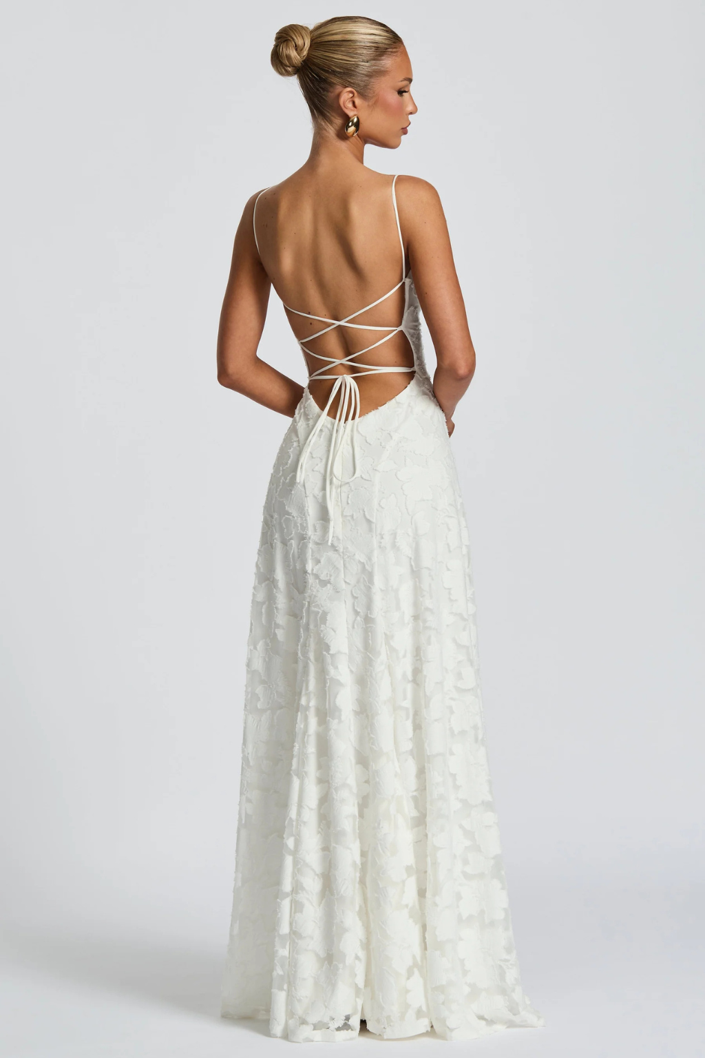 Sophisticated floral brocade long dress, ideal wedding guest or formal attire.