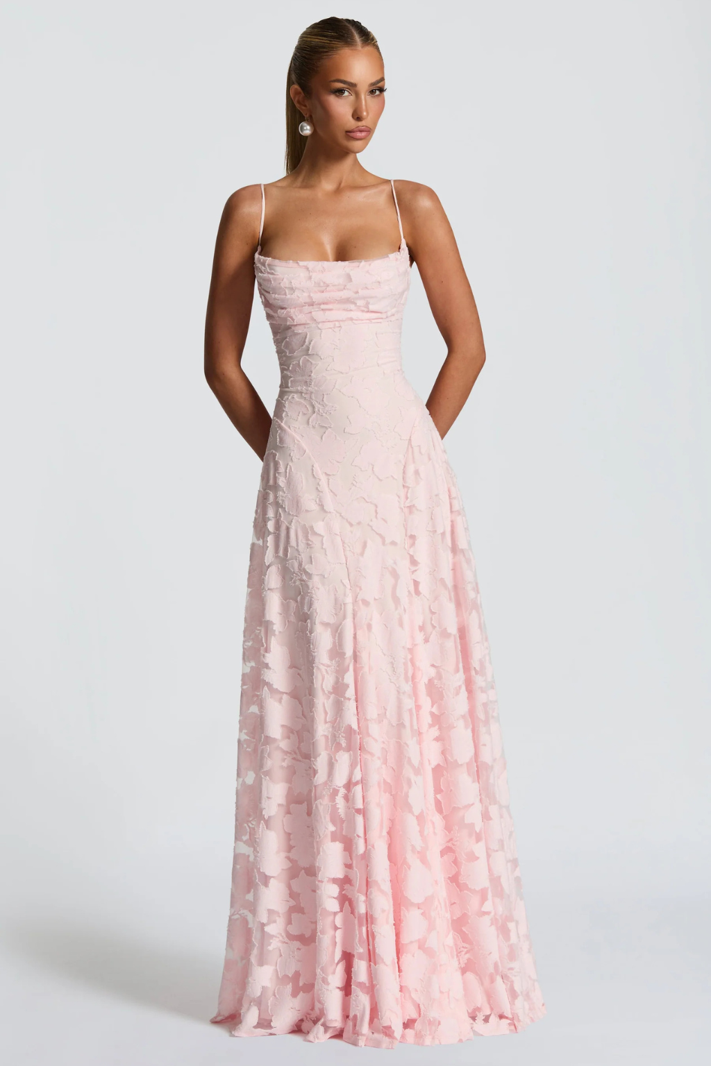 Chic women's floral brocade maxi dress with cami straps, elegant formal wear.