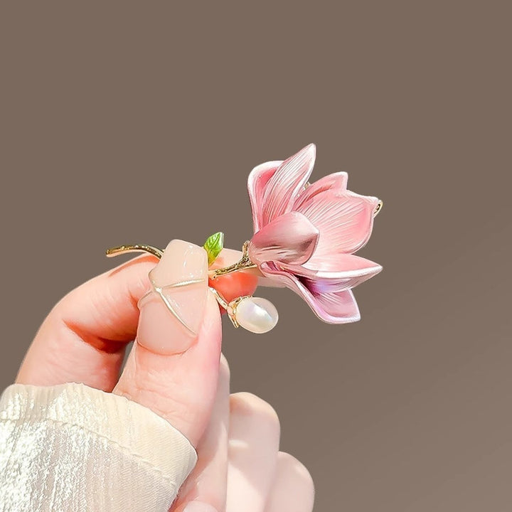 Women's fancy floral pin brooch, featuring delicate pink petals and sparkling crystal accents.