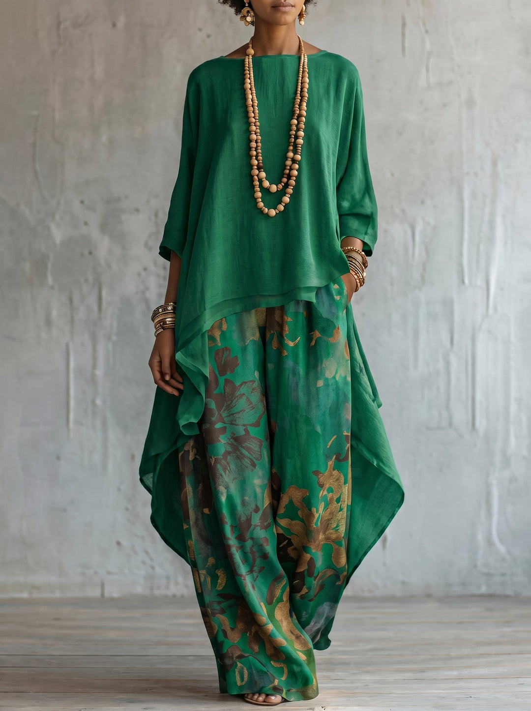 Women's matching floral two-piece set: elegant tunic and wide-leg pants. Ideal co-ord outfit for summer fashion.