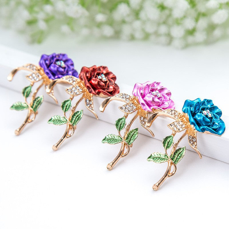 Elegant women's floral crystal brooch pin with rhinestones, perfect accessory for dresses & jackets.