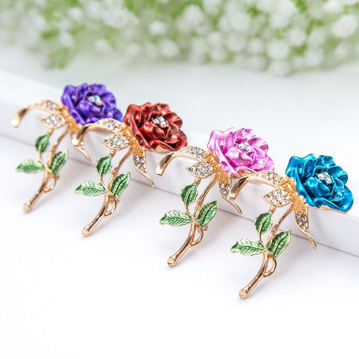 Elegant women's floral crystal brooch pin with rhinestones, perfect accessory for dresses & jackets.