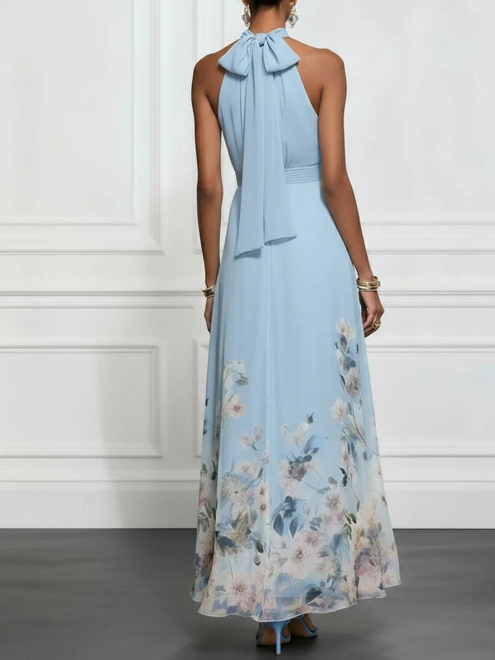 Feminine floral halter maxi dress for women, an elegant A-line summer party or occasion dress.