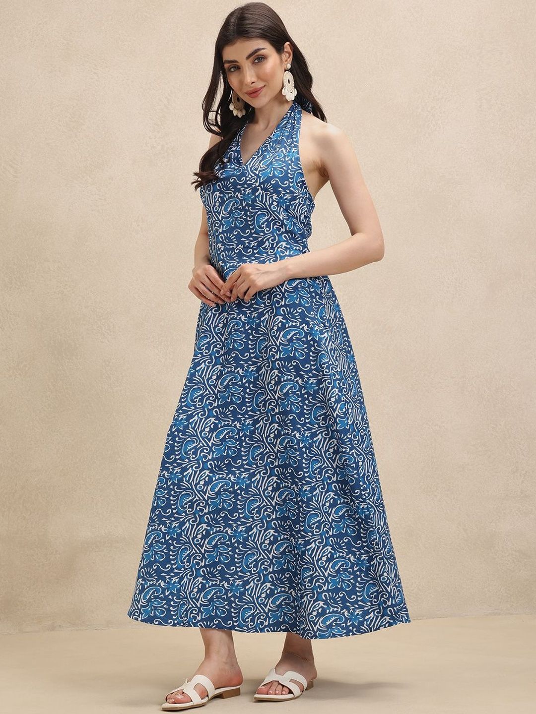 Elegant women's floral halterneck maxi dress. Perfect for summer vacations, beach outings, or spring parties.